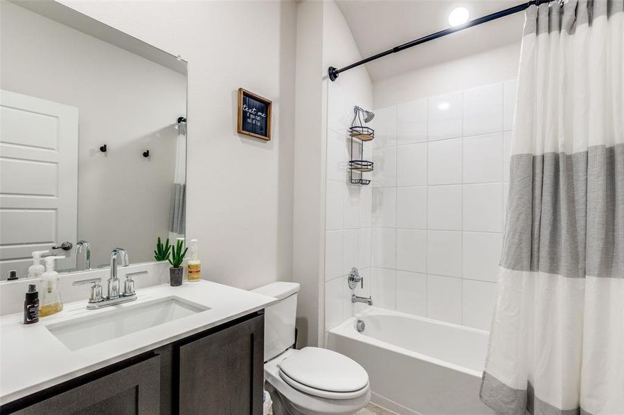 Bathroom with shower / bathtub combination with curtain and vanity Bathroom with shower / bathtub combination with curtain and vanity