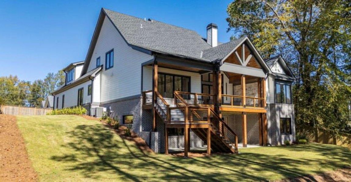 Front exterior of a new home in , Cumming, GA, highlighting curb appeal (Image 1).