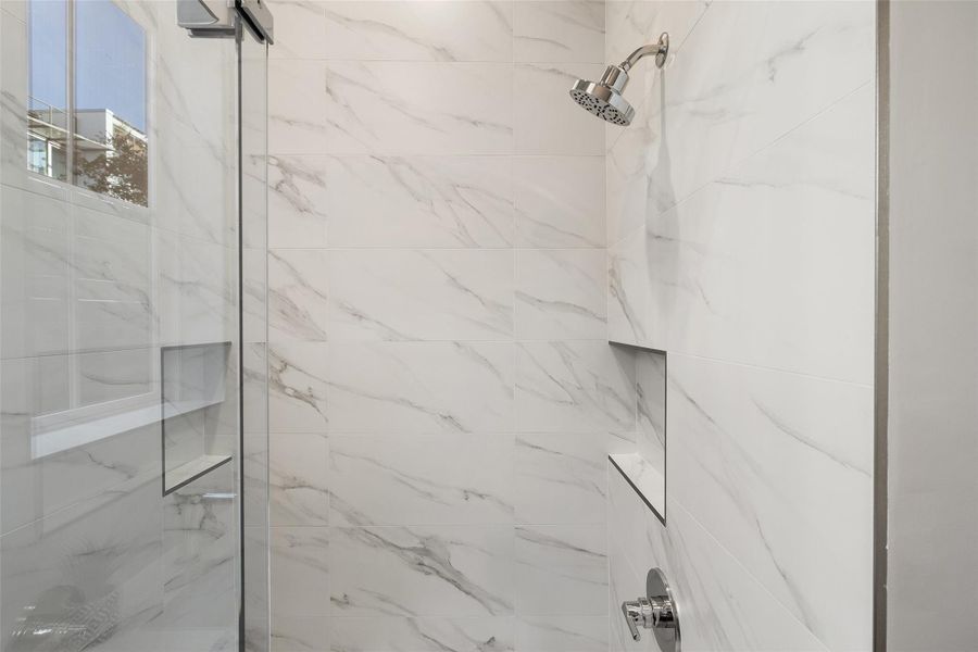 Bathroom with a tile shower