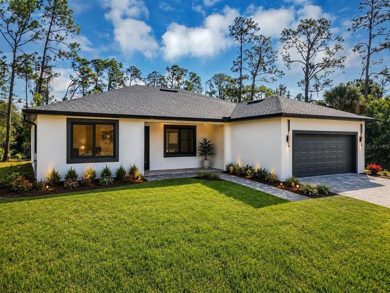 Front exterior of a new home in , Port Charlotte, FL, highlighting curb appeal (Image 1). Front exterior of a new home in , Port Charlotte, FL, highlighting curb appeal (Image 1).