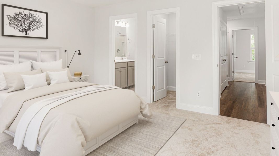 Owner's suite with walk-in closet & en suite bathroom in a DRB Homes Brookgreen model home