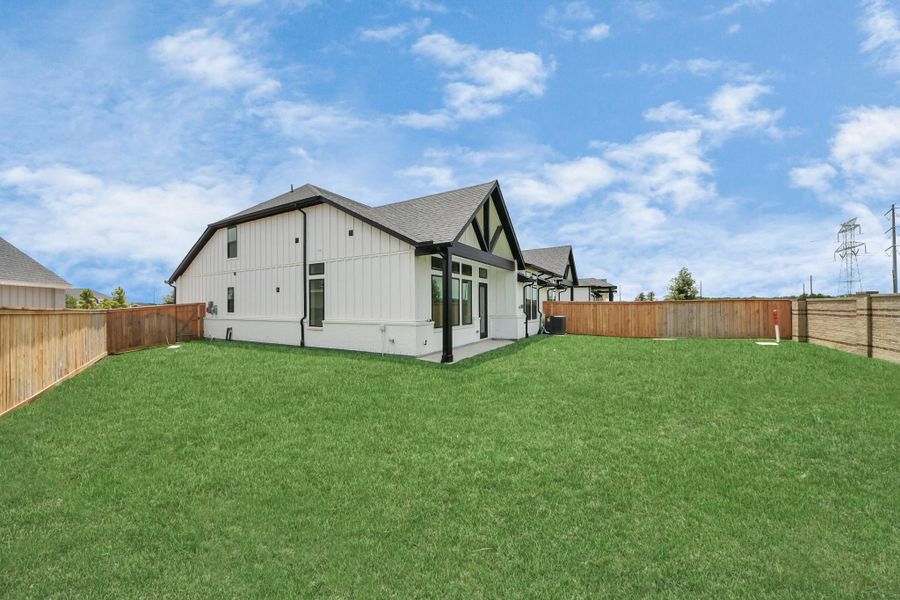 Front exterior of a new home in Bridgeland: Signature Collection, Cypress, TX, highlighting curb appeal (Image 20). Front exterior of a new home in Bridgeland: Signature Collection, Cypress, TX, highlighting curb appeal (Image 20).