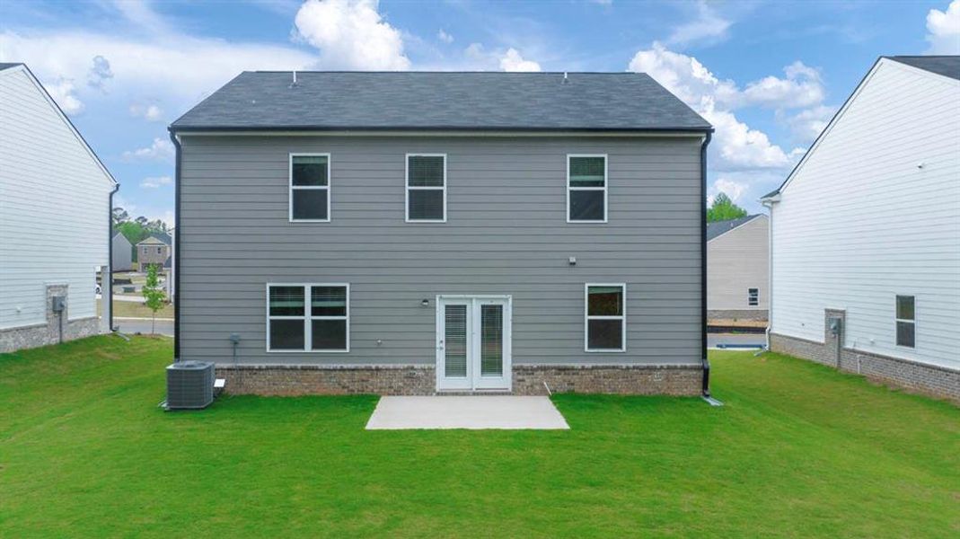 Front exterior of a new home in The Reserve at Calcutta, Stockbridge, GA, highlighting curb appeal (Image 19). Front exterior of a new home in The Reserve at Calcutta, Stockbridge, GA, highlighting curb appeal (Image 19).