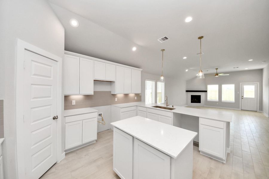 This generously spacious kitchen is a dream realized! Sample photo of completed home with similar floor plan. Actual colors and selections may vary. This generously spacious kitchen is a dream realized! Sample photo of completed home with similar floor plan. Actual colors and selections may vary.