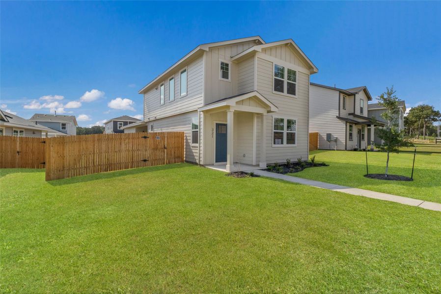 Front exterior of a new home in Valverde, Bastrop, TX, highlighting curb appeal (Image 1). Front exterior of a new home in Valverde, Bastrop, TX, highlighting curb appeal (Image 1).
