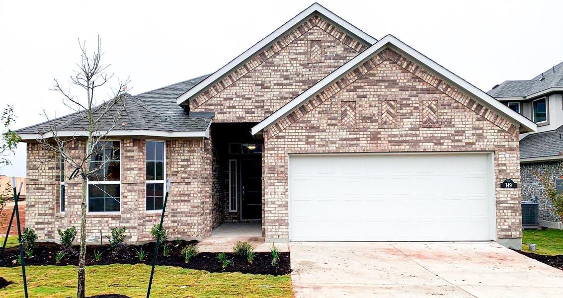 View of front facade featuring driveway, a garage, a shingled roof, and brick siding View of front facade featuring driveway, a garage, a shingled roof, and brick siding