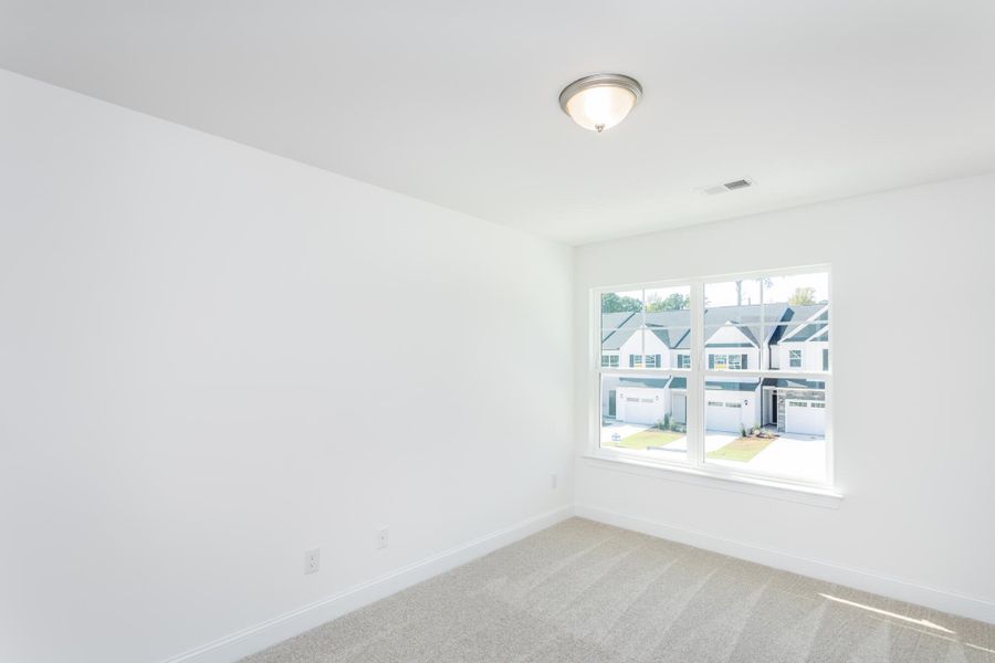 Spacious, unfurnished interior of a new home in Running Brook Townes, Durham (Image 13).