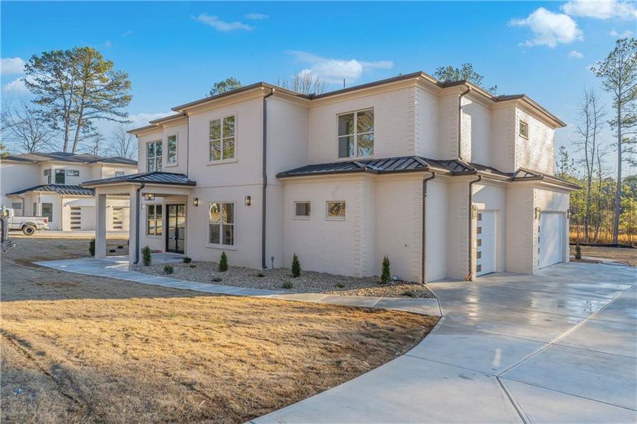 Front exterior of a new home in , Lawrenceville, GA, highlighting curb appeal (Image 1). Front exterior of a new home in , Lawrenceville, GA, highlighting curb appeal (Image 1).