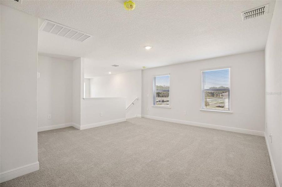 Spacious, unfurnished interior of a new home in The Reserve at Hammock Oaks - Classic Series, Lady Lake (Image 15).