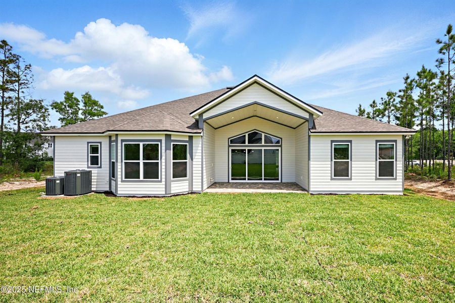 Front exterior of a new home in Courtney Oaks in SilverLeaf, St. Augustine, FL, highlighting curb appeal (Image 1). Front exterior of a new home in Courtney Oaks in SilverLeaf, St. Augustine, FL, highlighting curb appeal (Image 1).
