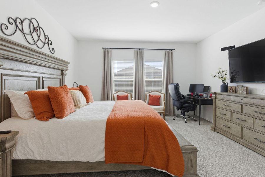 Spacious primary bedroom located on the first floor for comfort and privacy. Spacious primary bedroom located on the first floor for comfort and privacy.