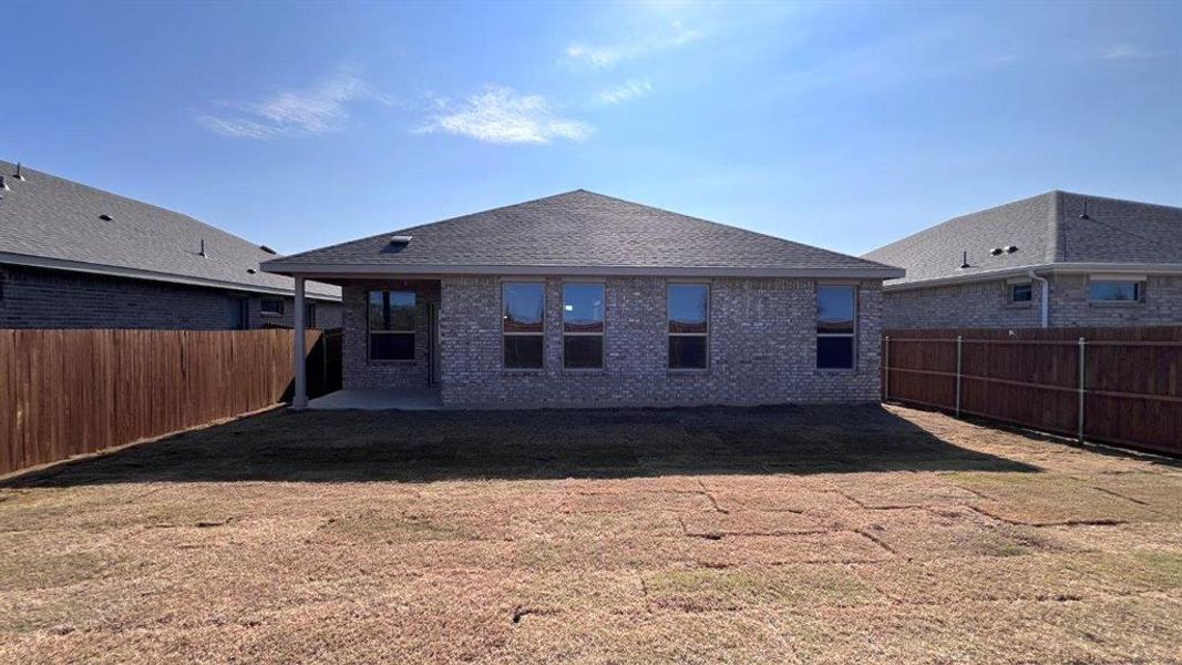 Exterior details and patio area of a home in Bluestem, Rhome (Image 3).