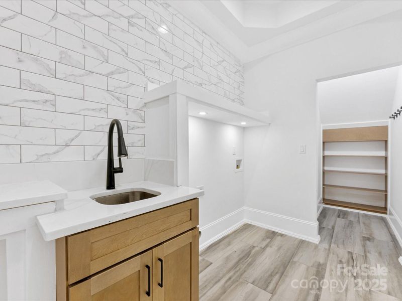 First Floor Laundry room with sink and closet area First Floor Laundry room with sink and closet area