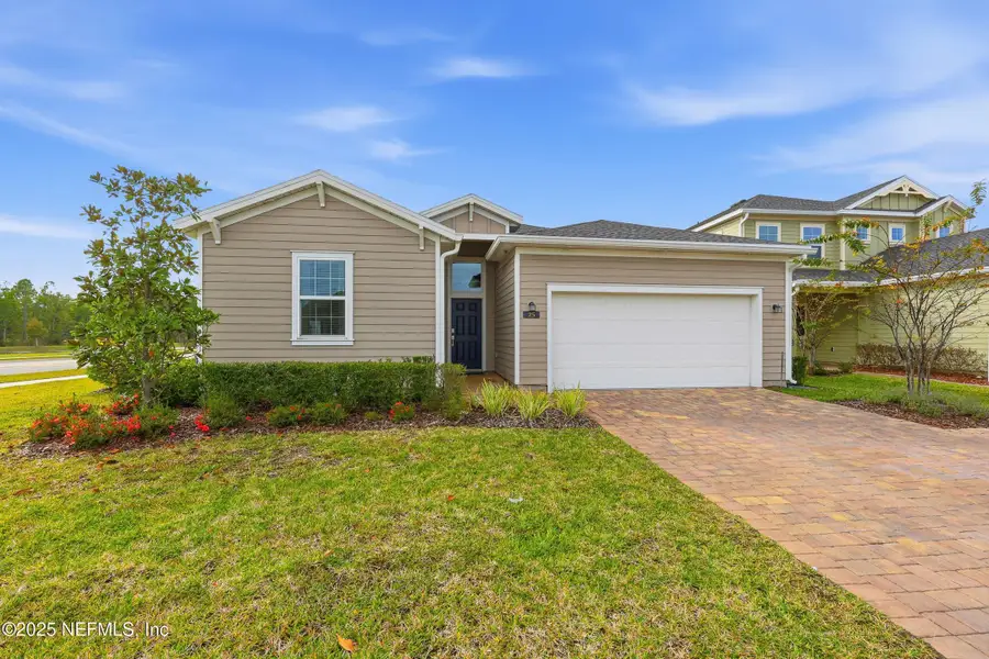 Front exterior of a new home in St Augustine Lakes: St Augustine Lakes 50S, St. Augustine, FL, highlighting curb appeal (Image 2). Front exterior of a new home in St Augustine Lakes: St Augustine Lakes 50S, St. Augustine, FL, highlighting curb appeal (Image 2).