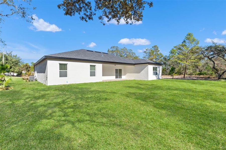 Exterior details and patio area of a home in , Brooksville (Image 33).