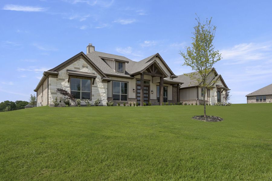 Front exterior of a new home in The Meadows, Gunter, TX, highlighting curb appeal (Image 25). Front exterior of a new home in The Meadows, Gunter, TX, highlighting curb appeal (Image 25).