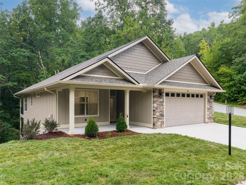 Front exterior of a new home in , Hendersonville, NC, highlighting curb appeal (Image 1). Front exterior of a new home in , Hendersonville, NC, highlighting curb appeal (Image 1).