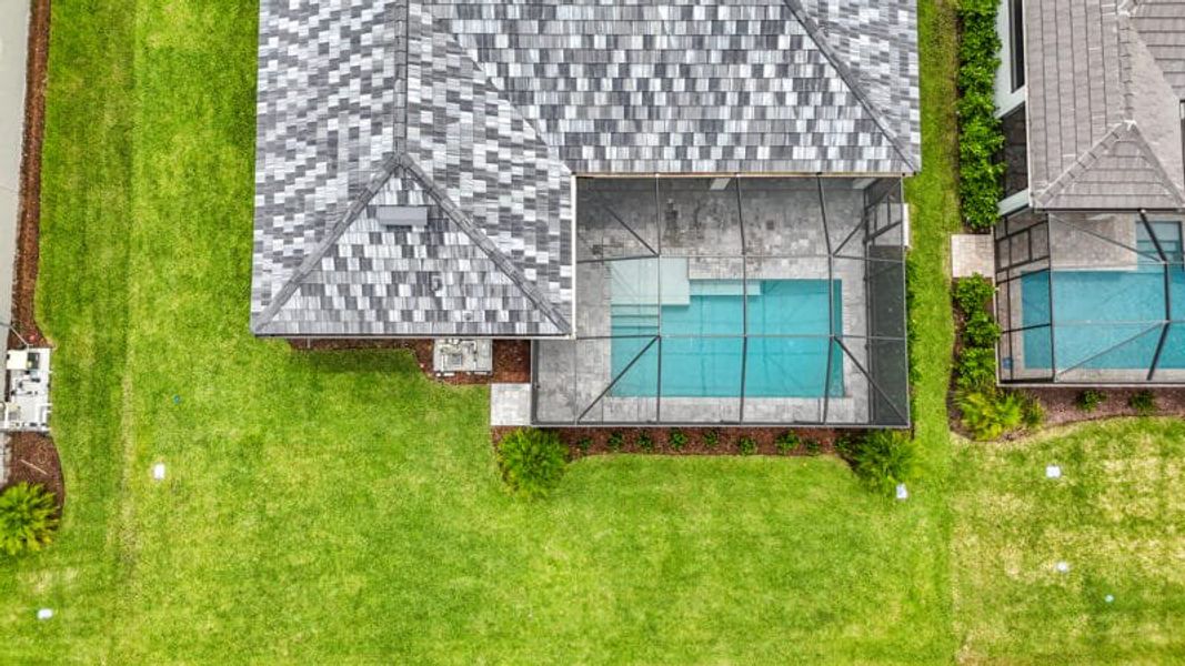 Exterior details and patio area of a home in River Preserve Estates, Parrish (Image 35).