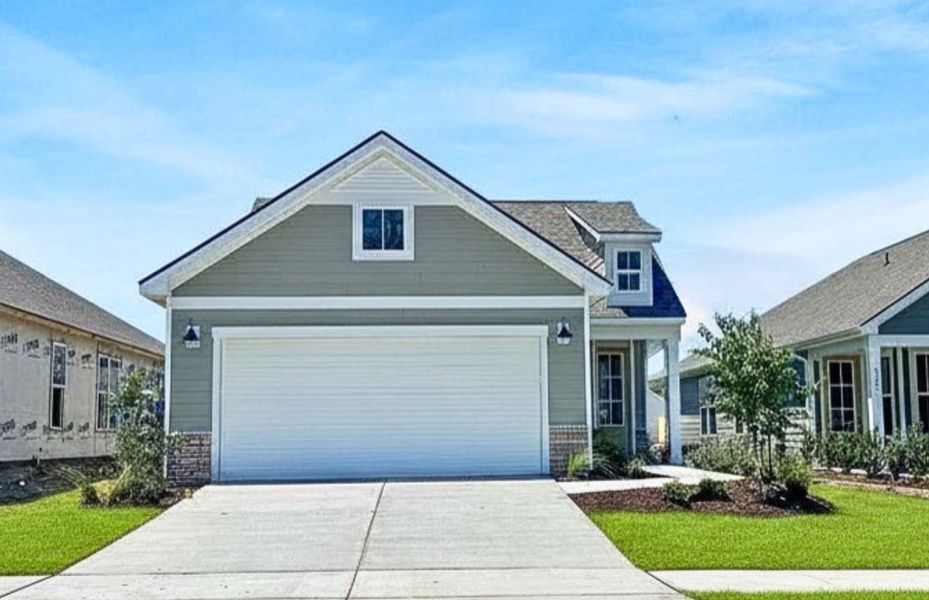 Front exterior of a new home in The Haven at Riverlights, Wilmington, NC, highlighting curb appeal (Image 2). Front exterior of a new home in The Haven at Riverlights, Wilmington, NC, highlighting curb appeal (Image 2).