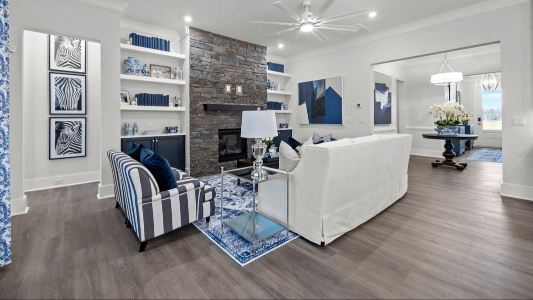 The Adventurer Plan by DBR Homes modern living area with large stone fireplace in Fort Mill, SC.