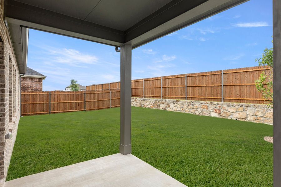 Exterior details and patio area of a home in Walden Pond, Forney (Image 22).