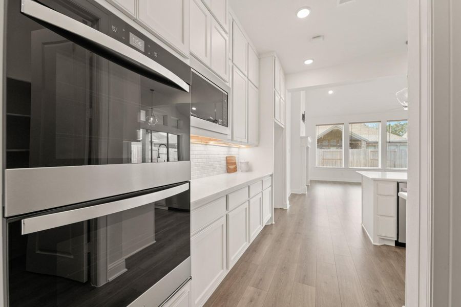 Furnished interior view inside a new home in The Highlands - 65', Porter (Image 9).