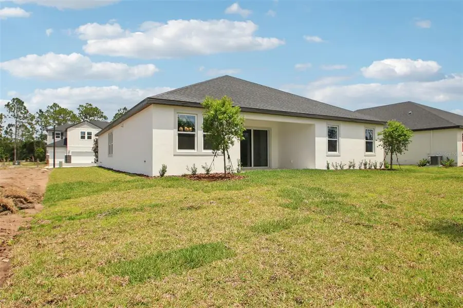 Exterior details and patio area of a home in Ridgehaven - Reserve Series, Ormond Beach (Image 4).