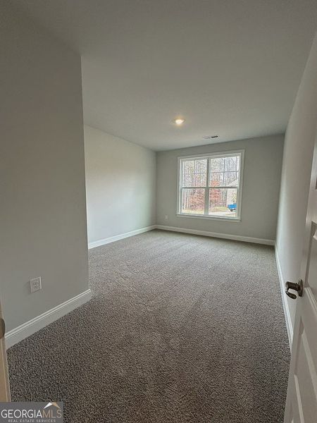 Spacious, unfurnished interior of a new home in Mirror Lake at South Harbour, Villa Rica (Image 21).