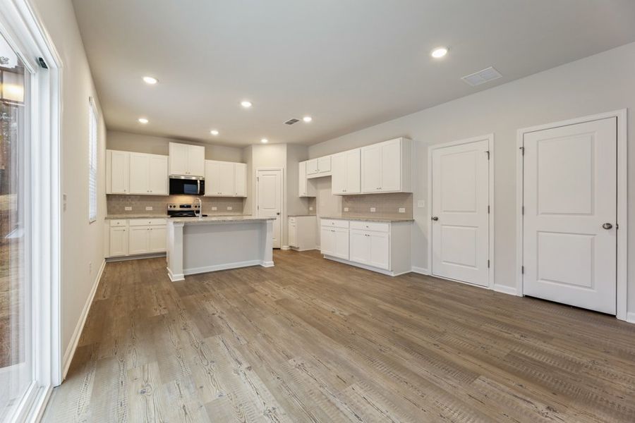 A kitchen with white cabinets. A kitchen with white cabinets.