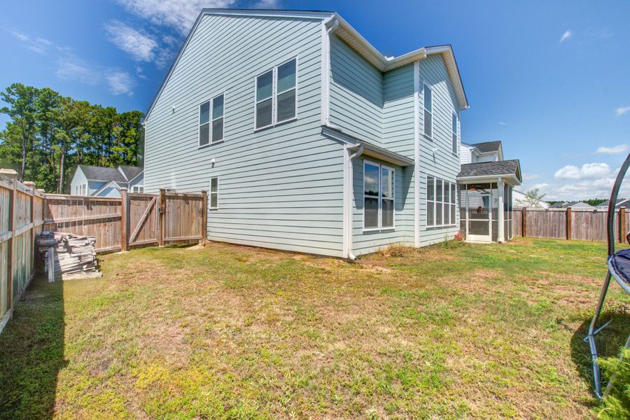 Exterior details and patio area of a home in Homecoming, Ravenel (Image 32).
