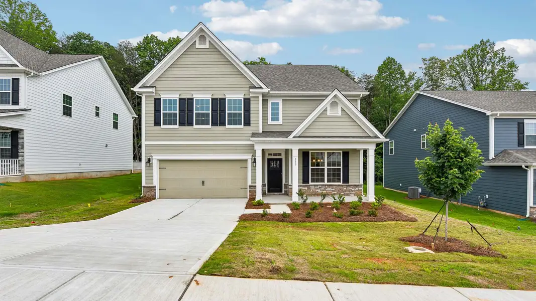 Front exterior of a new home in Sylvan Creek, Denver, NC, highlighting curb appeal (Image 1). Front exterior of a new home in Sylvan Creek, Denver, NC, highlighting curb appeal (Image 1).