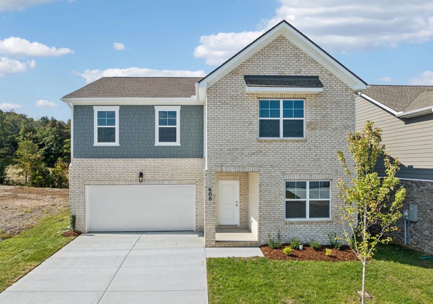 Front exterior of a new home in Cades Bluff, Lebanon, TN, highlighting curb appeal (Image 1).
