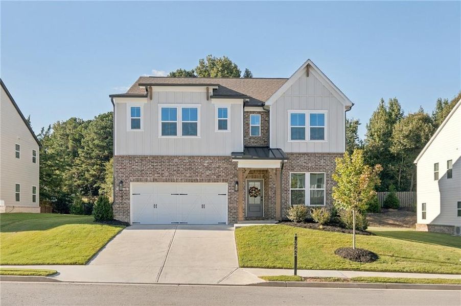 Front exterior of a new home in The Paddocks at Doc Hughes, Buford, GA, highlighting curb appeal (Image 2). Front exterior of a new home in The Paddocks at Doc Hughes, Buford, GA, highlighting curb appeal (Image 2).