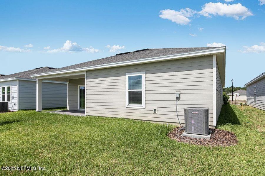 Front exterior of a new home in Coopers Meadow, Jacksonville, FL, highlighting curb appeal (Image 18). Front exterior of a new home in Coopers Meadow, Jacksonville, FL, highlighting curb appeal (Image 18).