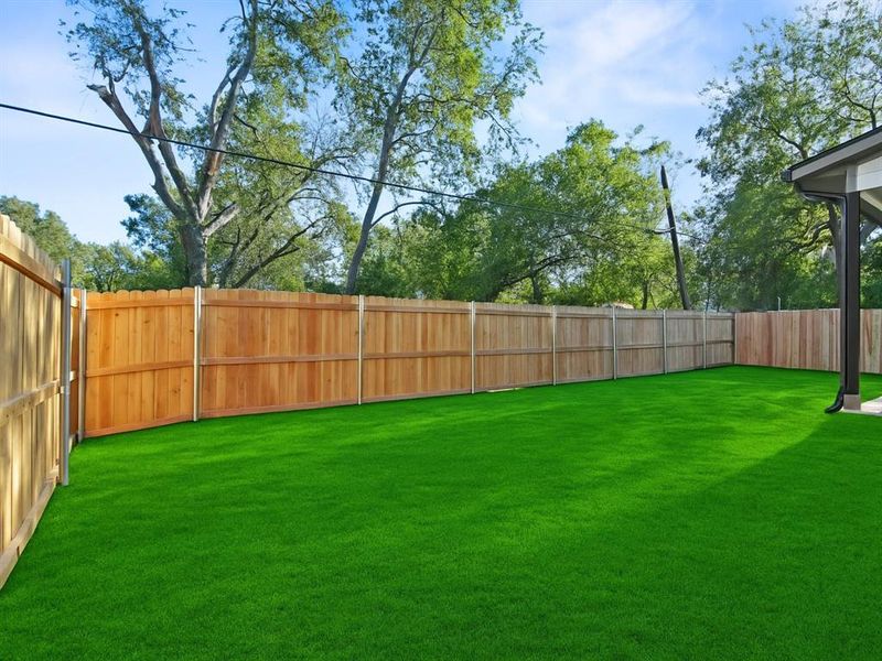 View of fenced backyard