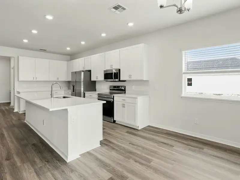 Your bright, open kitchen is well-appointed with quartz, 42-inch cabinets, Samsung SS appliances, and a walk-in pantry. Your bright, open kitchen is well-appointed with quartz, 42-inch cabinets, Samsung SS appliances, and a walk-in pantry.