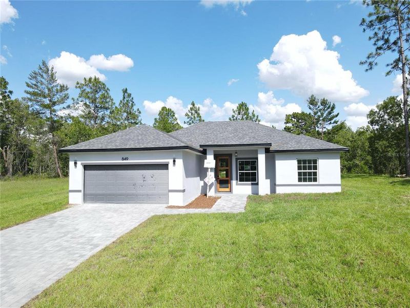 Front exterior of a new home in , Ocala, FL, highlighting curb appeal (Image 4).