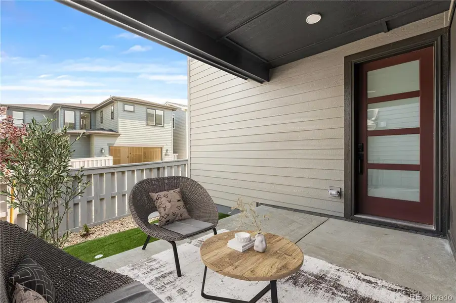 Exterior details and patio area of a home in Storytellers at Lyric, Lone Tree (Image 4).