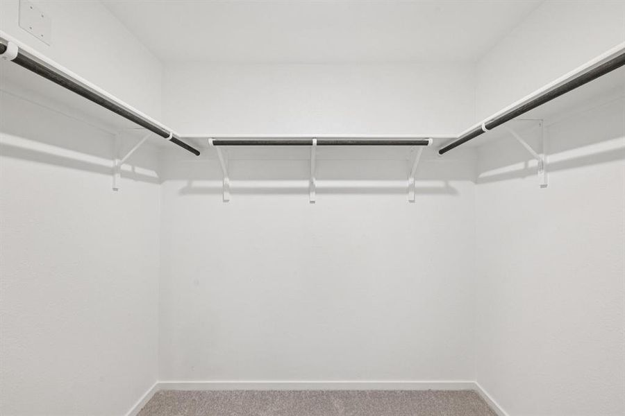 Walk in closet with light carpet Walk in closet with light carpet