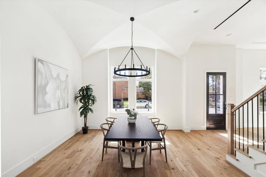 Open and Inviting - This Luxurious family room features a coffered ceiling, a brilliant fireplace flanked by shelving on both sides anchored by wide planked hardwood engineered floors. It exudes both warmth and sophistication Glass expanse doors open to the backyard seamlessly blending indoor outdoor living.