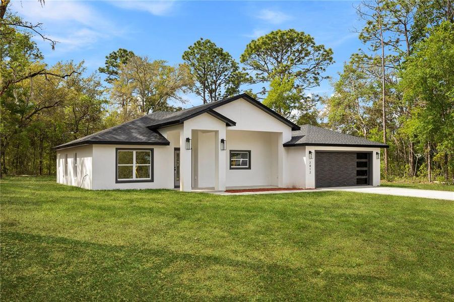 Front exterior of a new home in , Dunnellon, FL, highlighting curb appeal (Image 27).