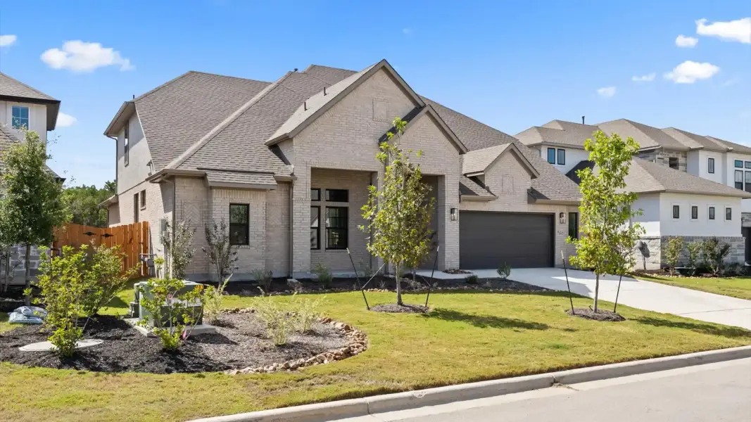 Front exterior of a new home in Sweetwater, Austin, TX, highlighting curb appeal (Image 19).