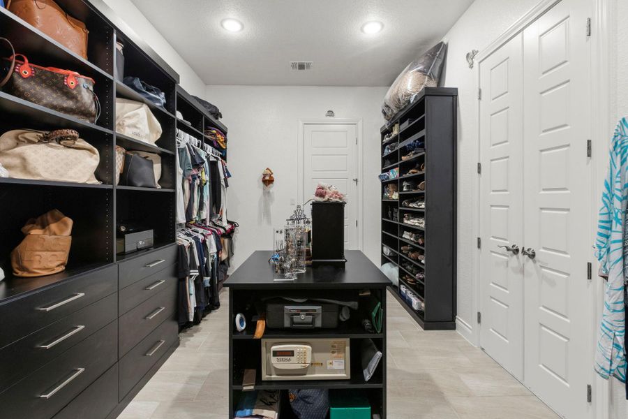 Ample closet space with built-in storage solutions and well-lit interiors.