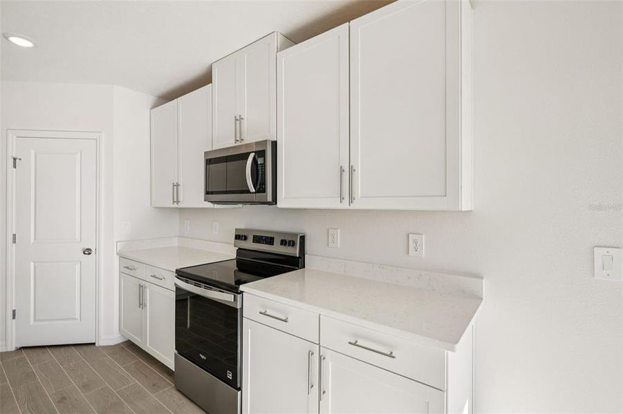 Furnished interior view inside a new home in The Grove at Stuart Crossing - Classic Series, Bartow (Image 10).
