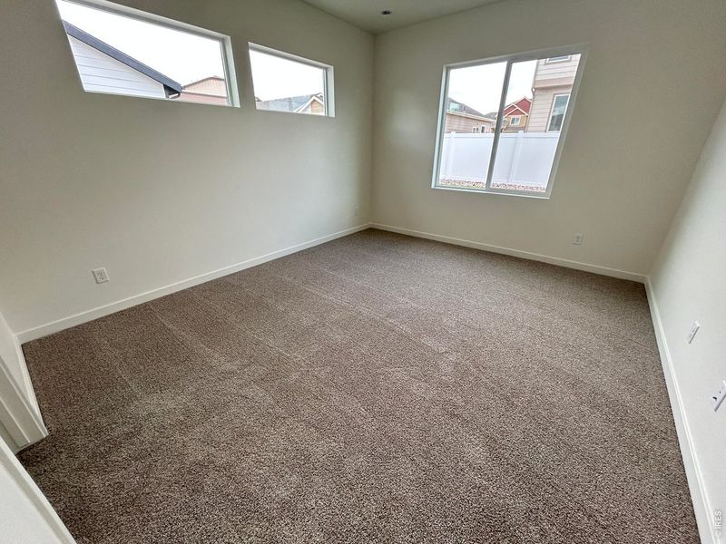 Spacious, unfurnished interior of a new home in Union Colony West, Greeley (Image 12).