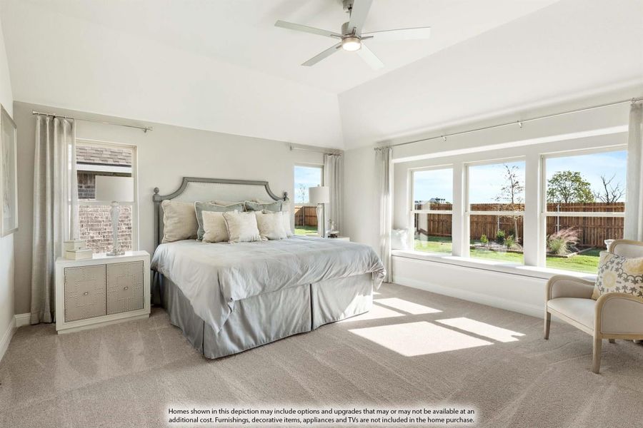 Master bedroom with vaulted ceiling, ceiling fan, carpet flooring, and large windows with backyard views