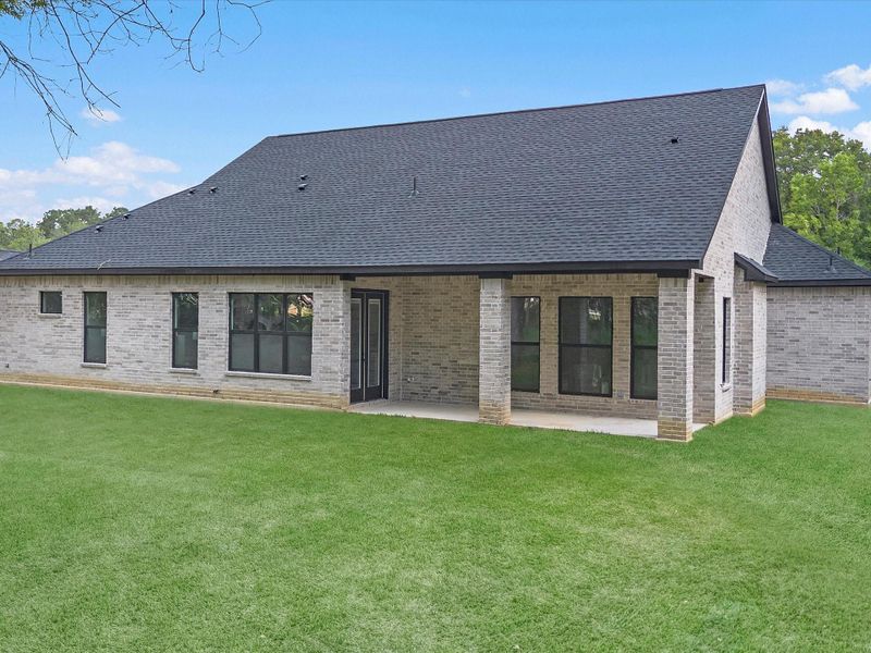 Front exterior of a new home in , Dayton, TX, highlighting curb appeal (Image 24). Front exterior of a new home in , Dayton, TX, highlighting curb appeal (Image 24).