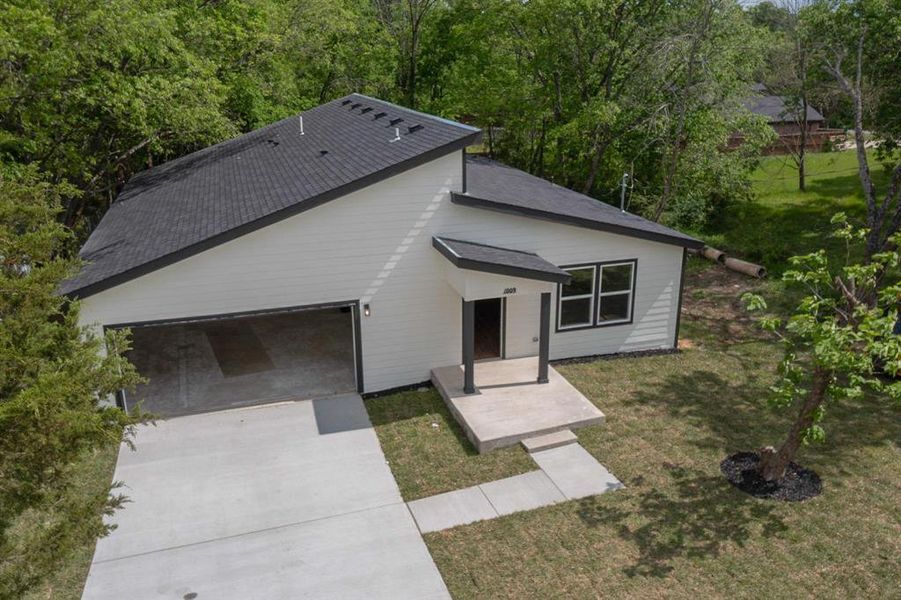 Front exterior of a new home in , Seagoville, TX, highlighting curb appeal (Image 26).