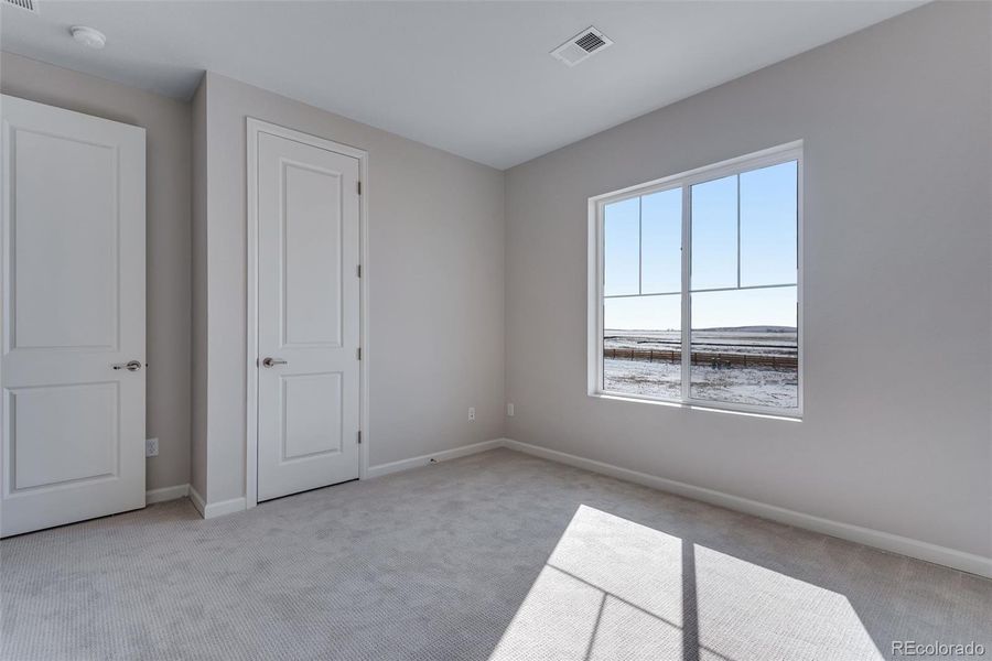 Spacious, unfurnished interior of a new home in Medley at Reunion Ridge, Commerce City (Image 22).