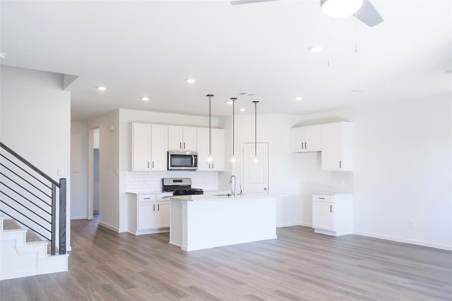 Kitchen leading to  front entry way.